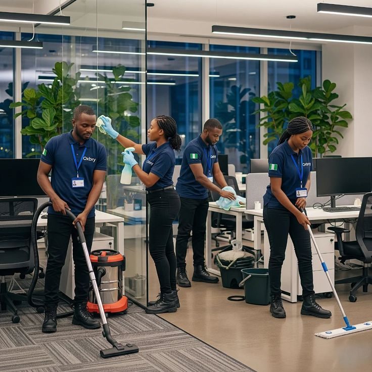 Omo-Emwiokpa CleanCare team cleaning an open-plan office